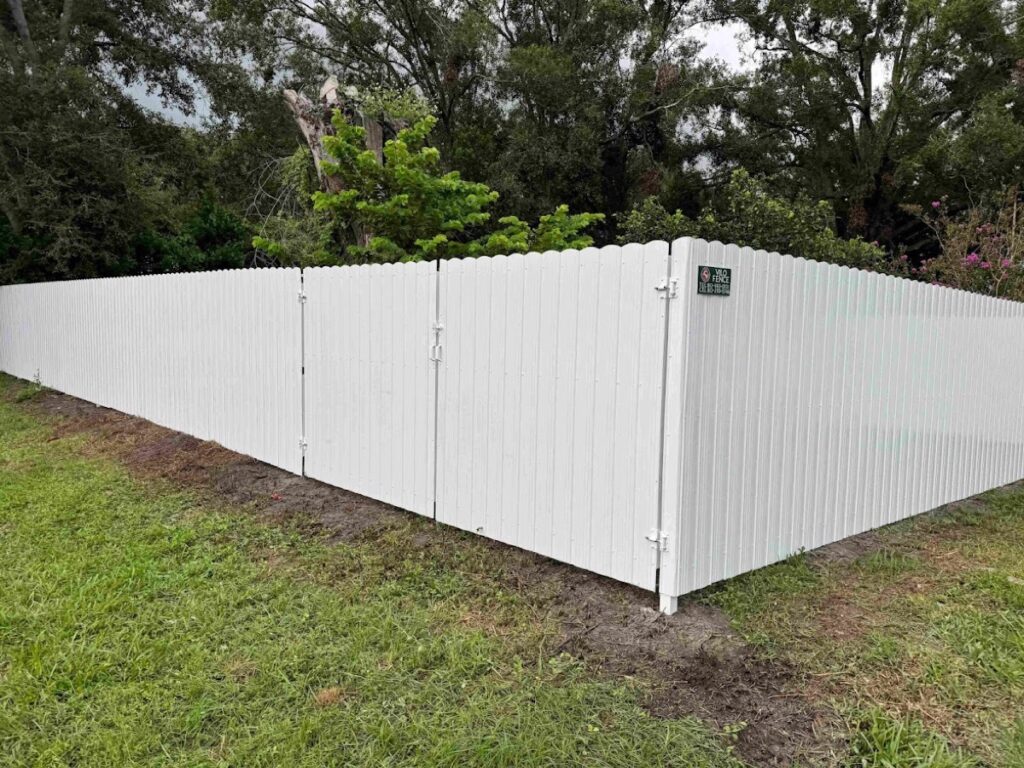 Galvanized palisade security fence with double gates, installed by Vilo Fence in Tampa